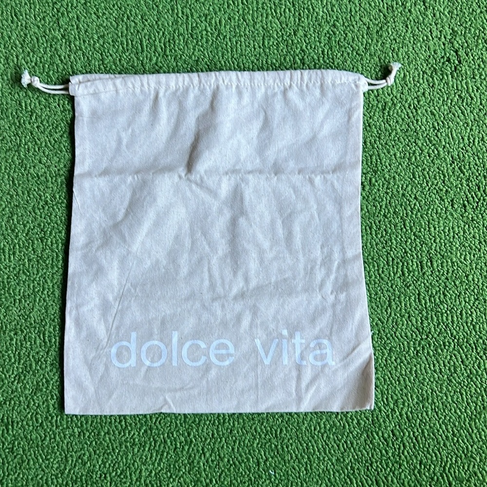 Dolce Vita dust bag. 13.5 by 15 inches. Draw strap. Beige with white letters.